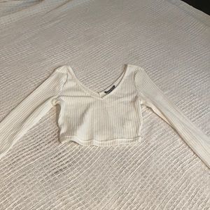 Cropped low neck long sleeve